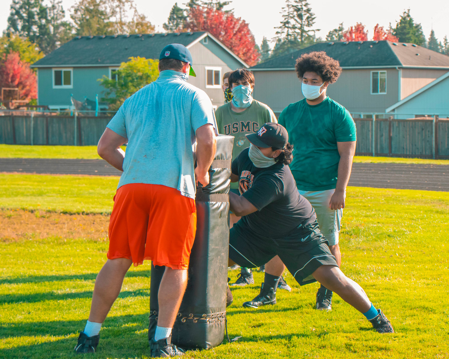 Football players hit pads during a practice at Napavine High School on Wednesday.