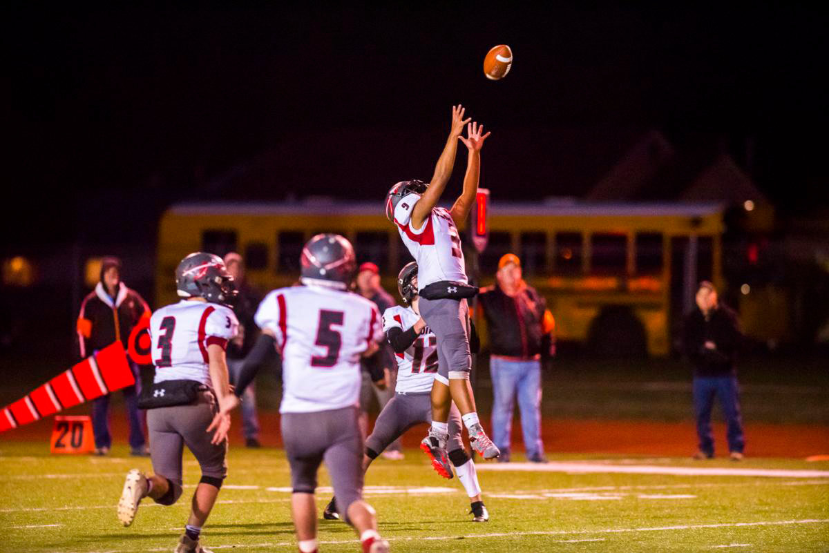Jacob Marley (9) leaps for a ball during a Toledo High School football game in fall 2019.