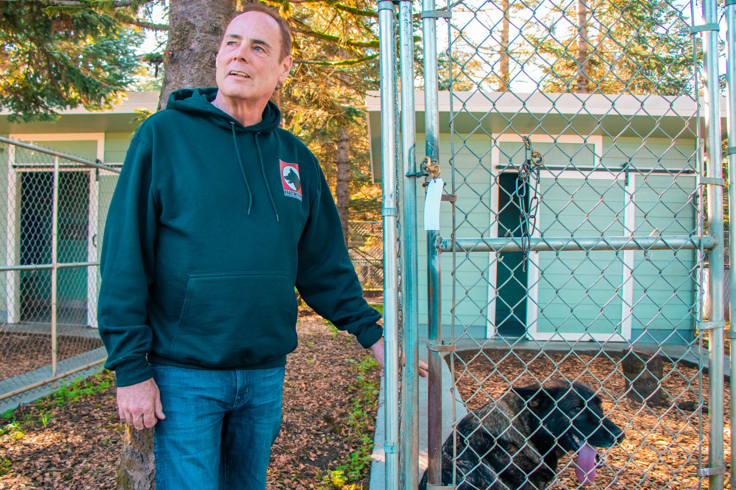 Wayne Curry talks about the uniquely designed kennels and living conditions Tuesday afternoon at Kraftwerk K9 German Shepherds in Rochester.