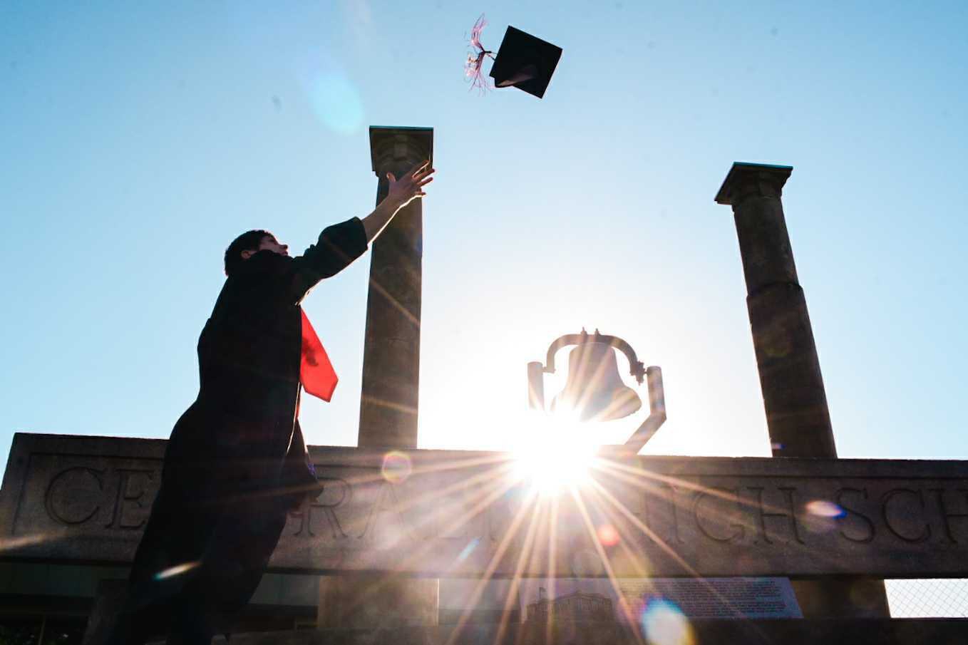 Jasen Wenzelburger, a 2020 graduate, throws up his graduation cap last June at Centralia High School.