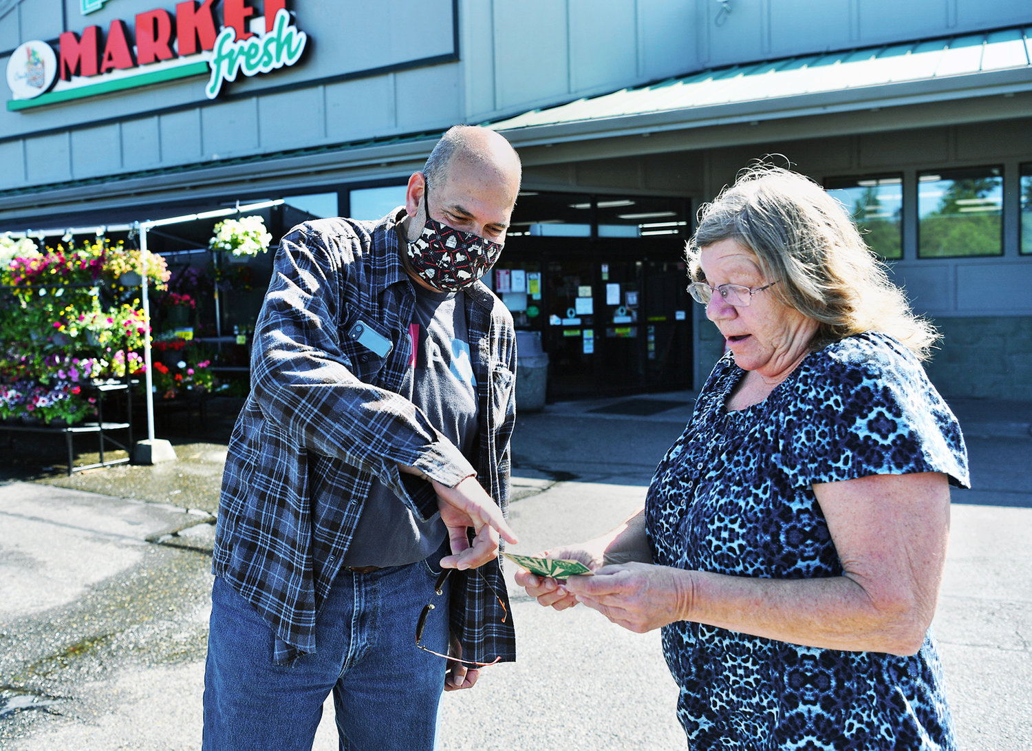 Franc Sawatzki, 55, from Whidbey Island, traveled to Tenino on Friday, June 26, to see if you could buy three scrips of Tenino wooden money. He wanted them as souvenirs for himself and family members. As luck would have it, Tenino resident Lauretta Mahlenbrei happened to be at Market Fresh at the same time with one of the four scrips she still has. Despite Sawatzki's cajoling, Mahlenbrei refused to sell.