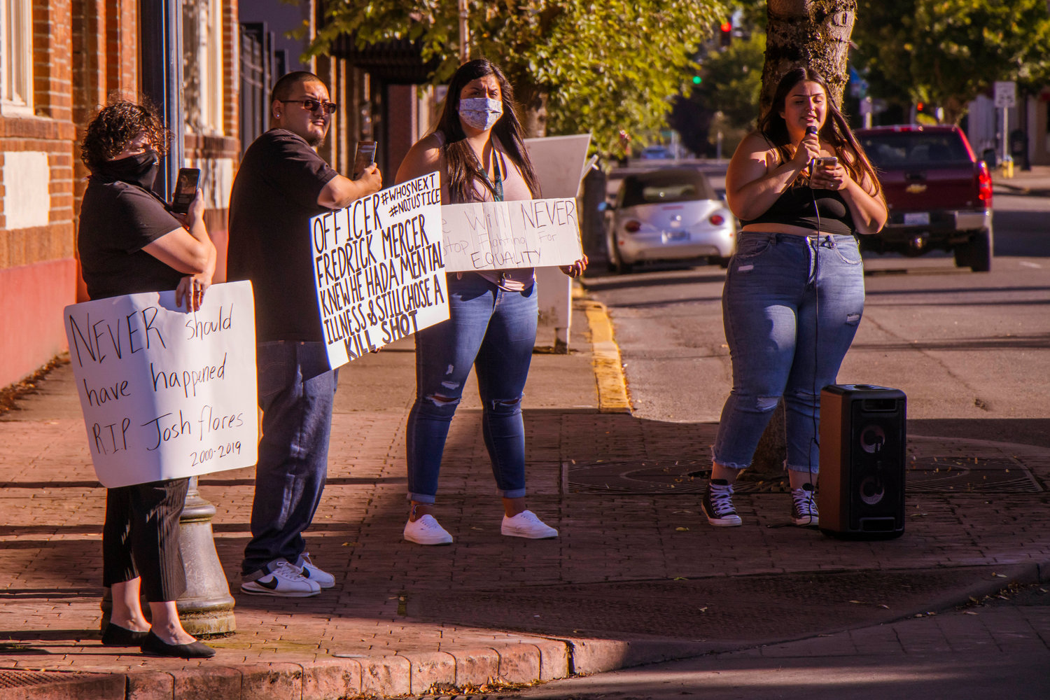 Demonstrators gather outside the Centralia Police Station Monday afternoon to honor the life of Joshua Flores who died on June 18, 2019 at the age of 18.