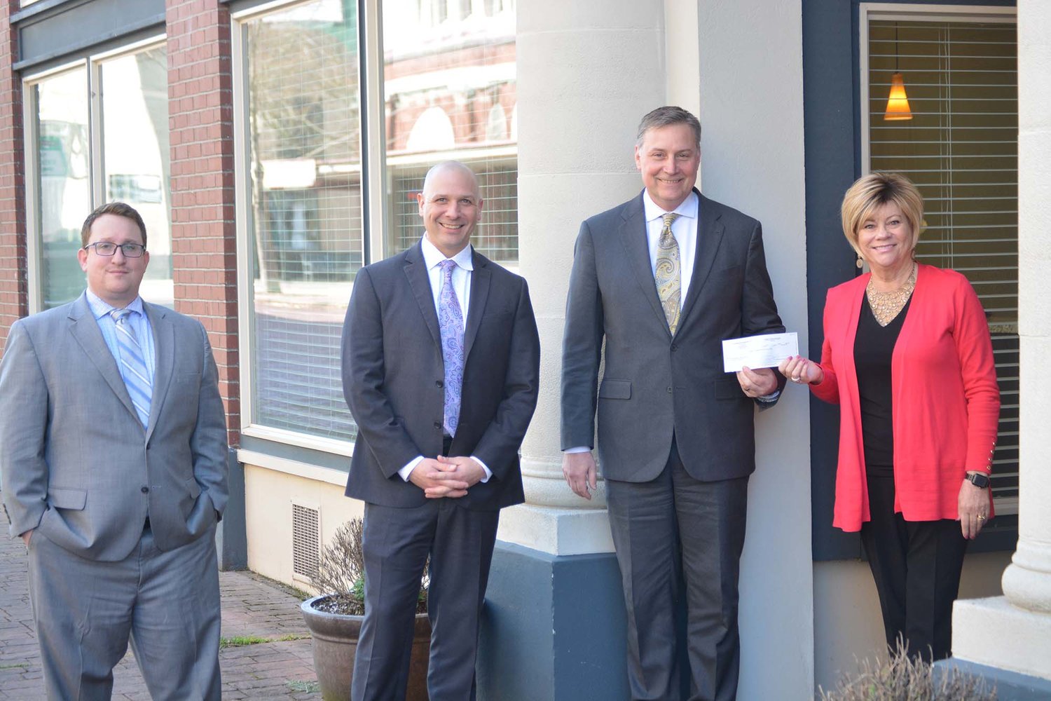 Althauser Rayan and Abbarno, LLP Partners Jakob McGhie, Peter Abbarno and Todd Rayan pose with United Way of Lewis County Executive Director Debbie Campbell and the $3,000 check dedicated to United Way’s COVID-19 Response Fund