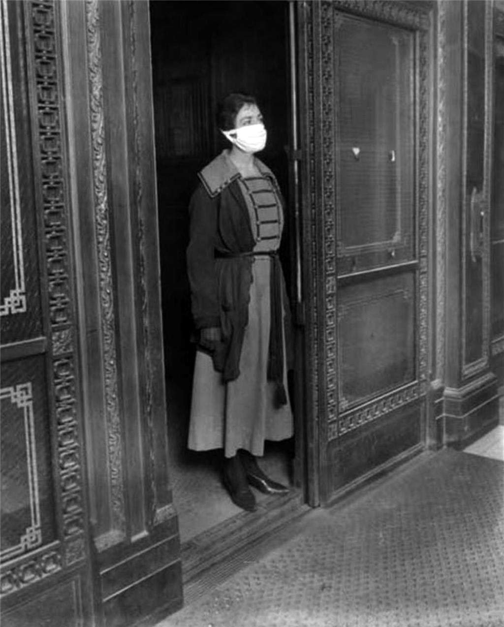 Masked elevator attendant during flu pandemic, Seattle, 1918