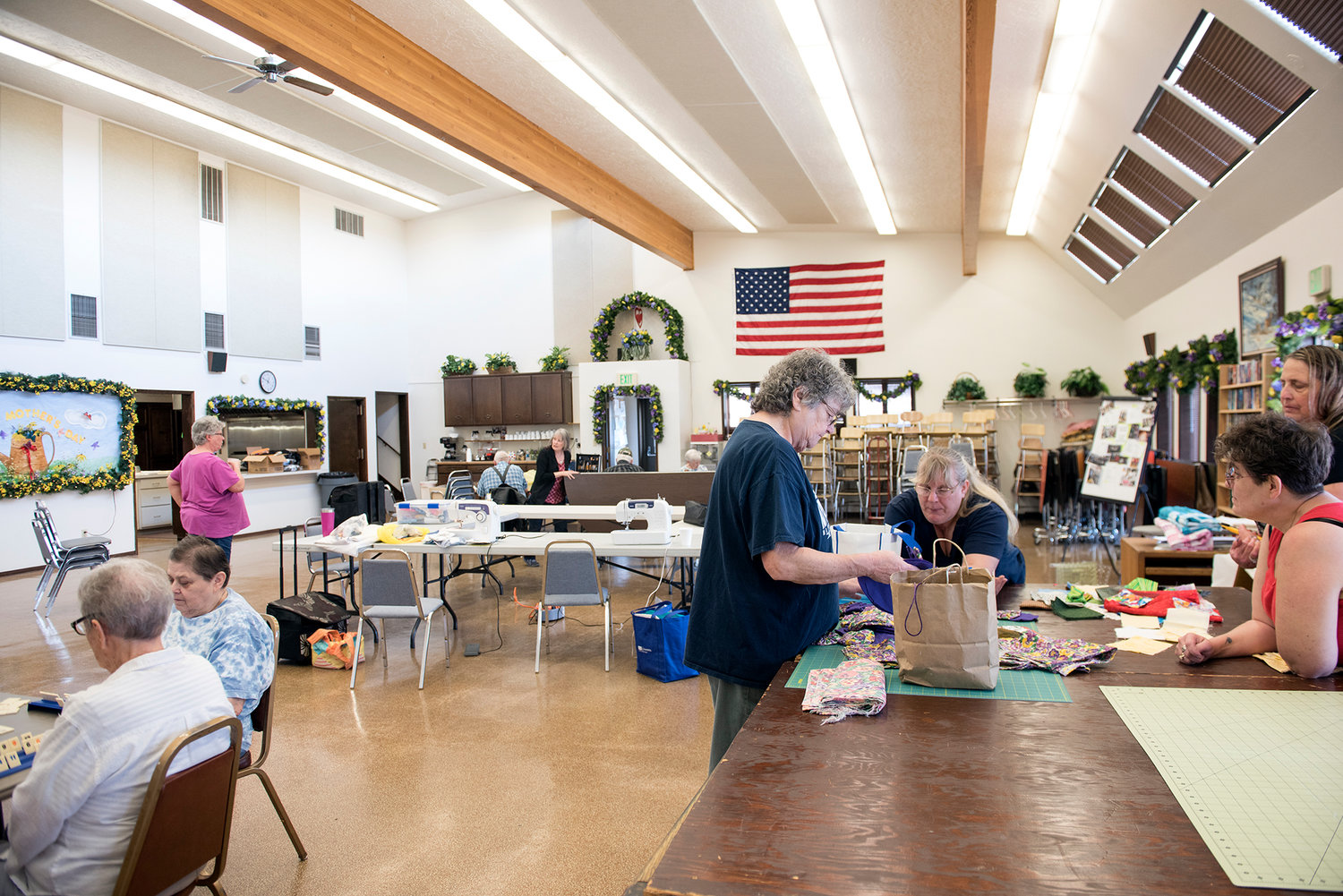 2017 FILE PHOTO — People play games, carve wooden figurines and go through sewing supplies on a typical Thursday afternoon at the Toledo Senior Center.