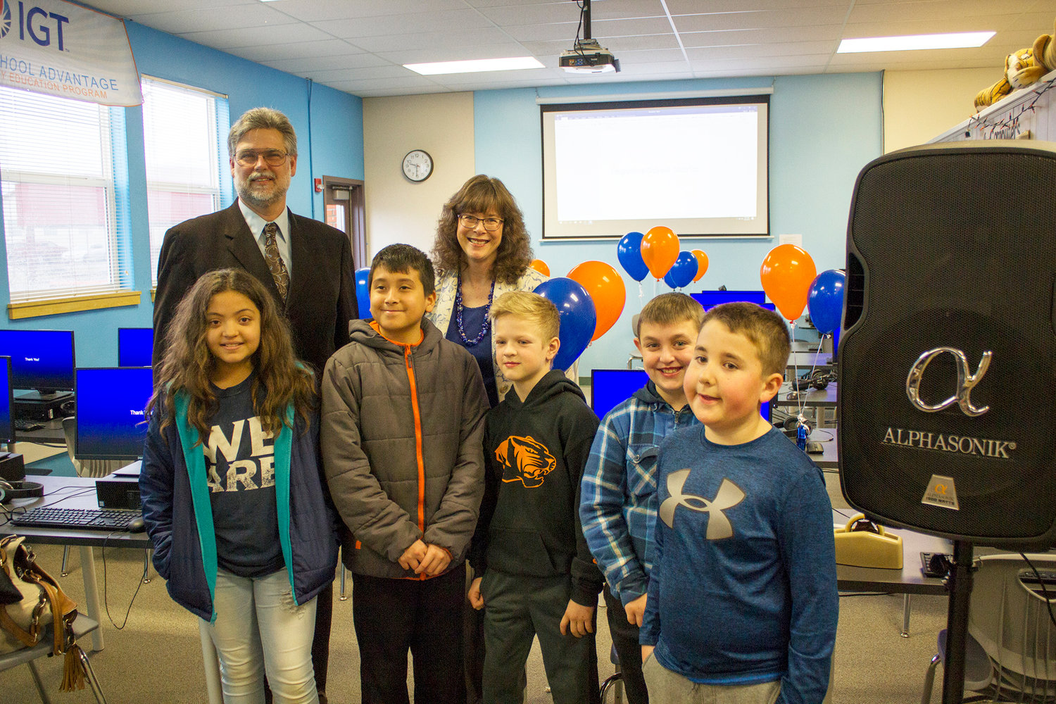 Representative Ed Orcutt, R-Kalama, and Ruth Peterson from the office of Senator John Braun, R-Centralia, stand in the upgraded lab with fourth grade Napavine Elementary School students. From left to right: Ivy Torres, Santos Alvarado, Caleb Vonpressentin, Nolan Fulleton and Gavin Brevard.