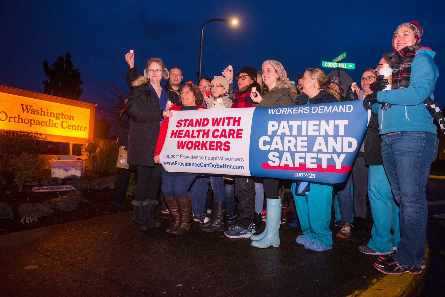 Nurses hold a "candlelight vigil" earlier this month to advocate for more favorable terms in their contract with Providence. 