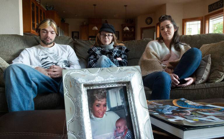 The children of Karen Bodine share memories of their mother at their grandparents home in south Thurston County on Friday, Nov. 29, 2019. From left are Tanner Bodine, Karlee Bodine and Taylor Bodine.