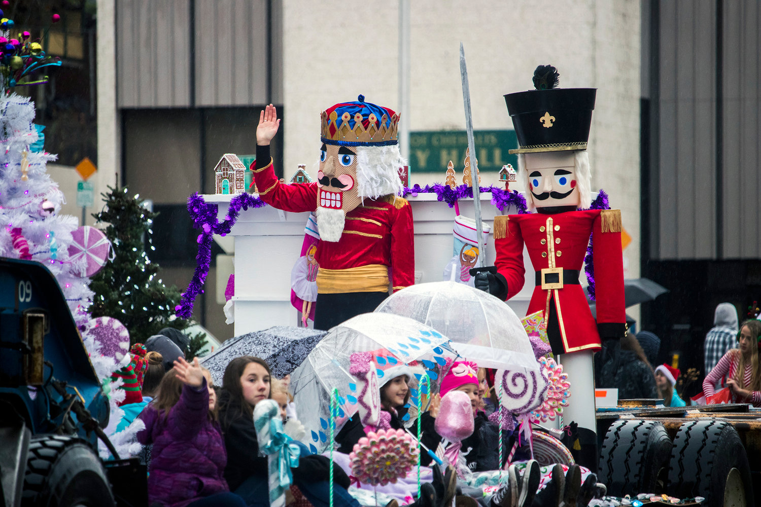 A woman dressed as a nutcracker waves to crowds during the annual Santa Parade Saturday morning in downtown Chehalis.