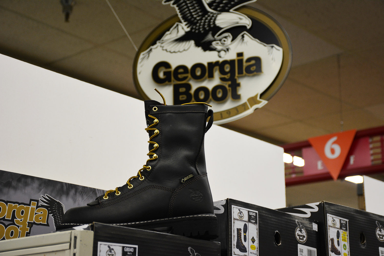 A pair of Georgia Boots are seen below a sign advertising the products at the Yelm Sunbird Shopping Center.
