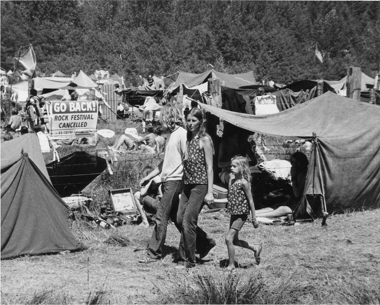 A family walks through the Tenino Sky River Rock Festival and Lighter Than Air Fair, which took place on Labor Day weekend in 1969.