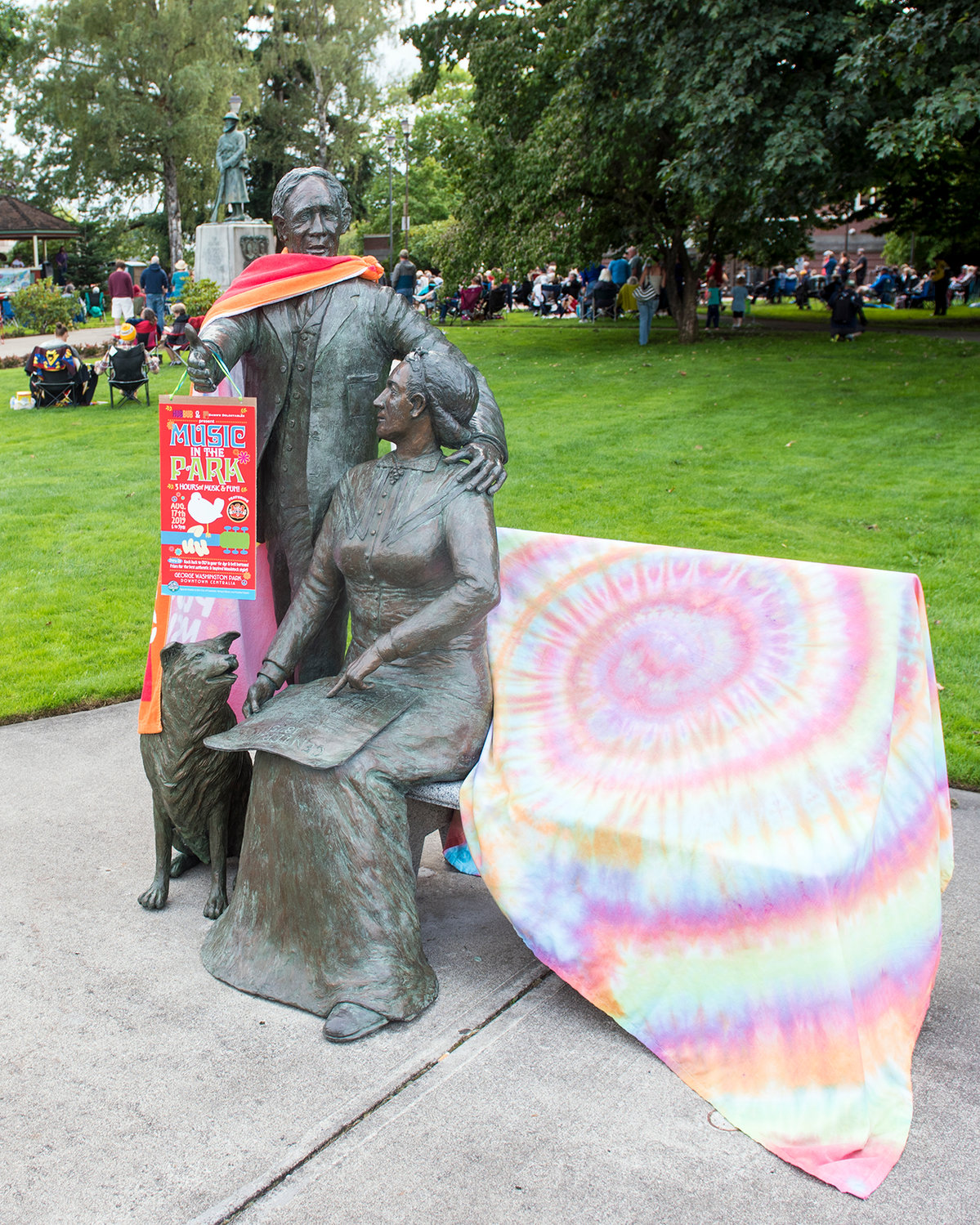 The statue of George and Mary Jane Washington sported the appropriate attire Saturday for a Woodstock-themed Music in the Park in downtown Centralia.