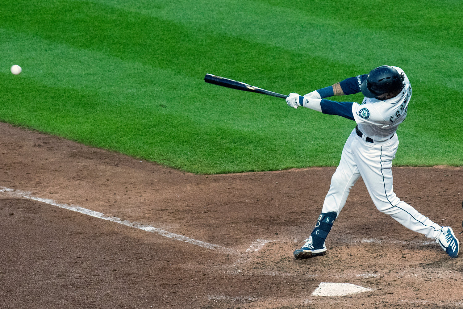 Seattle Mariners shortstop J.P. Crawford rips a double down the right field line against the Texas Rangers during a Major League Baseball game on Tuesday, July 23, 2019, at T-Mobile Park in Seattle.