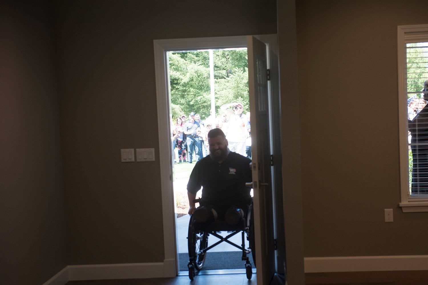 Army Sgt. Jereme Sawyer enters his new house in Tenino for the first time as its owner on Saturday, July 20, 2019.