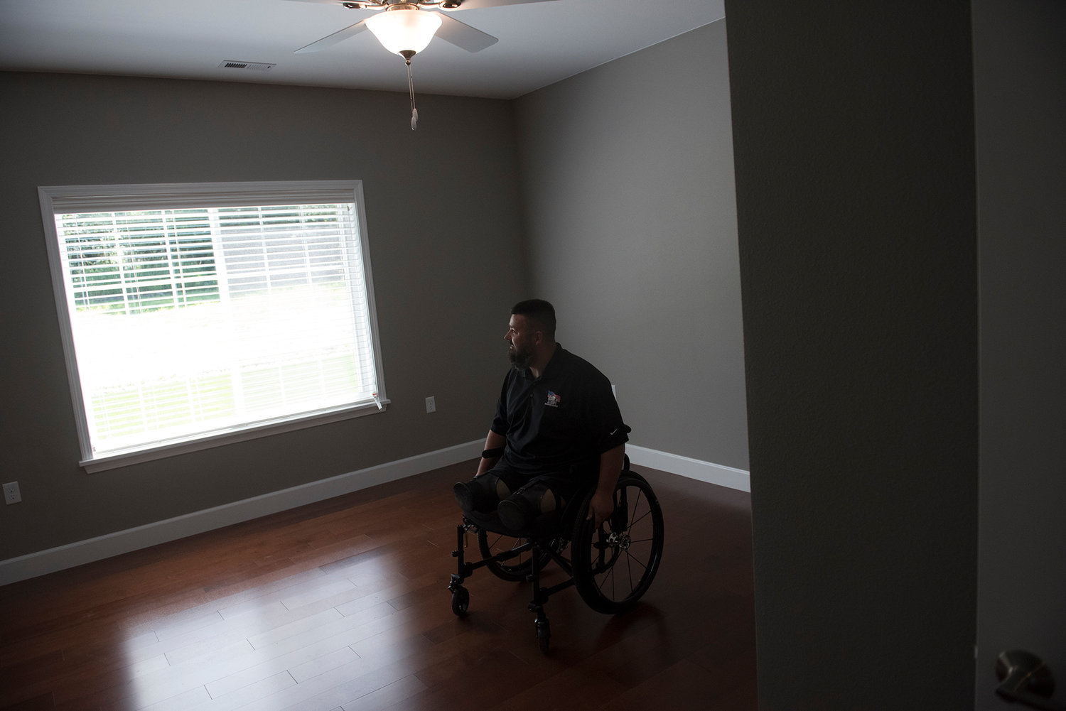 U.S. Army Sgt. Jereme Sawyer takes a look around his new house in Tenino on Saturday, July 20, 2019.