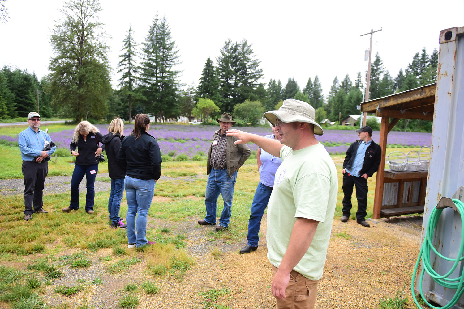 Justin Claibourn, co-owner of the Cowlitz Falls Lavender Company, talks to regional leaders about his operation and the challenges he faces during the Lewis County Farm Bureau Tour of Ag Wednesday afternoon.