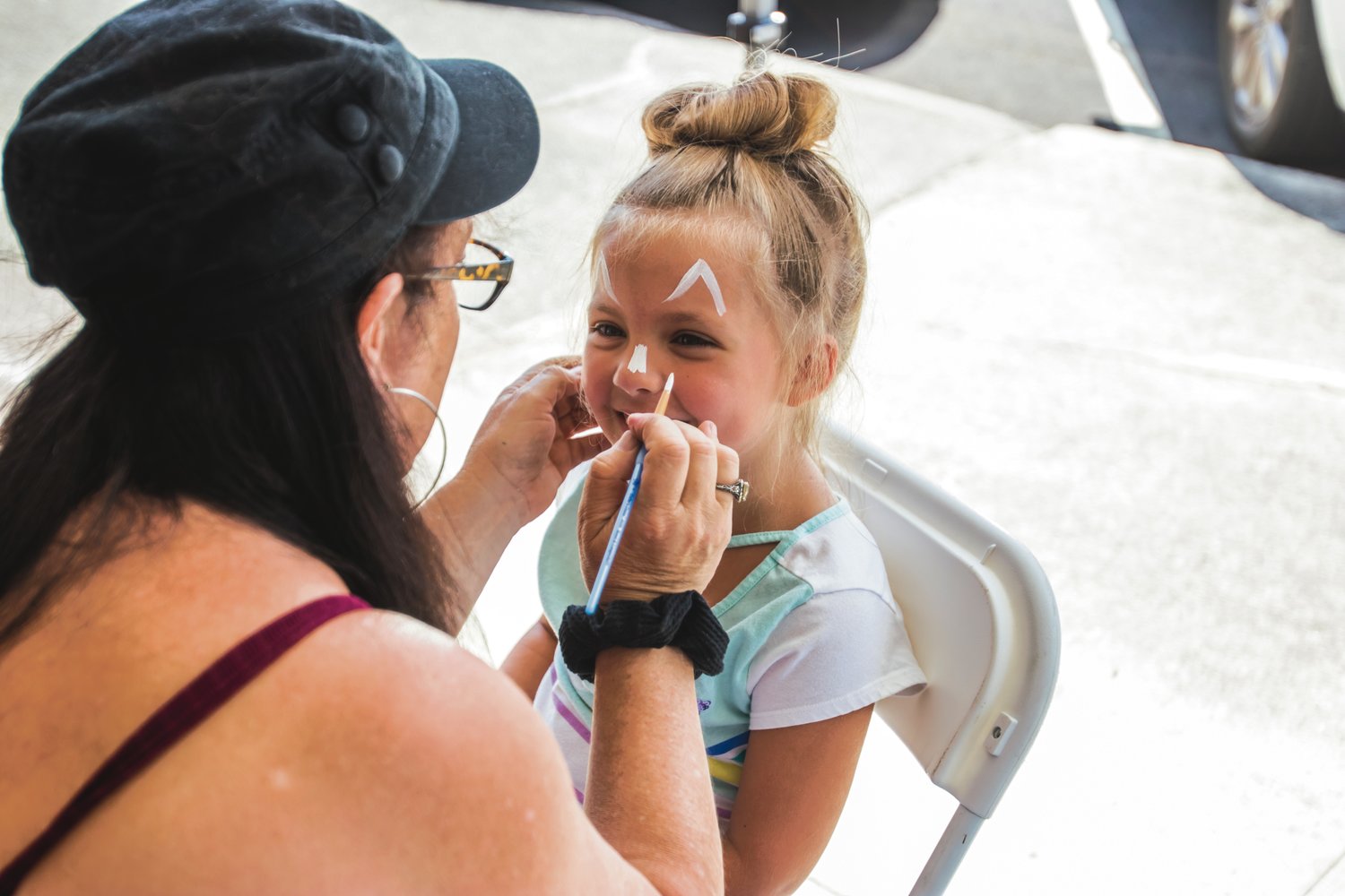 Elli Gallagher, 6, gets her face painted during Chehalisfest Saturday afternoon in downtown Chehalis.