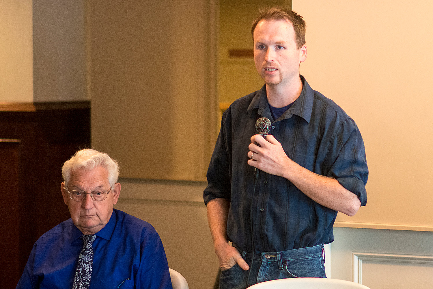Centralia City Council candidate Ron Greenwood gives his opening statement as incumbent Lee Coumbs listens during a debate Thursday held by the Centralia-Chehalis Chamber of Commerce.