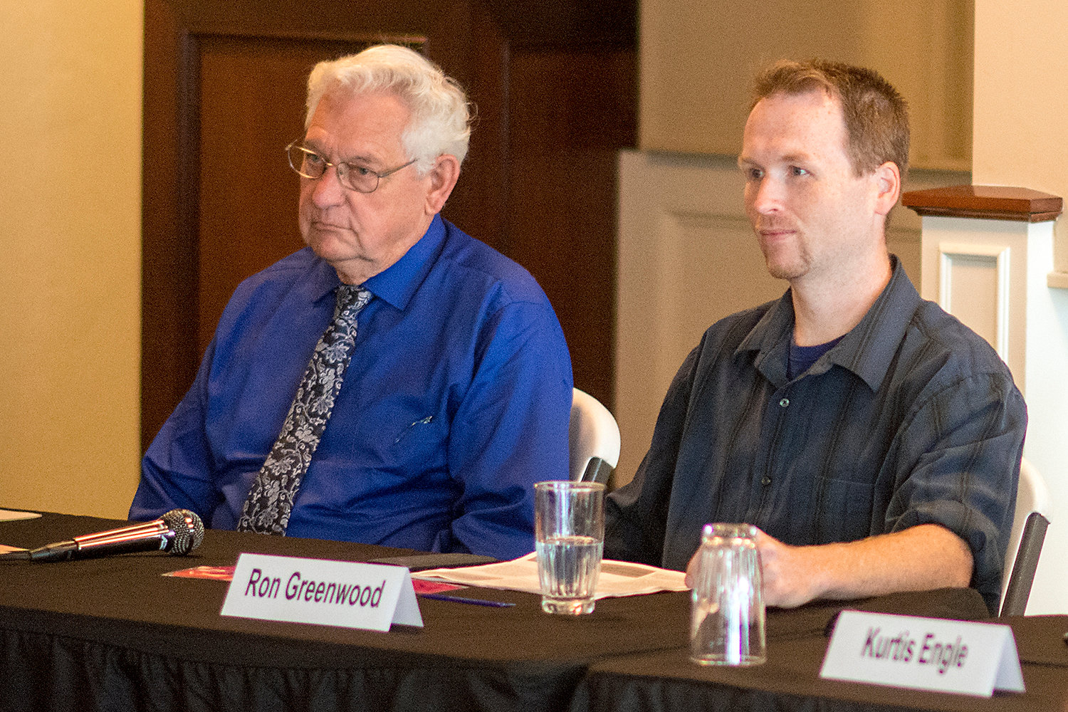 Incument Centralia City Council member Lee Coumbs, who serves as mayor, sits next to fellow candidate Ron Greenwood on Thursday during a debate hosted by the Centralia-Chehalis Chamber of Commerce.