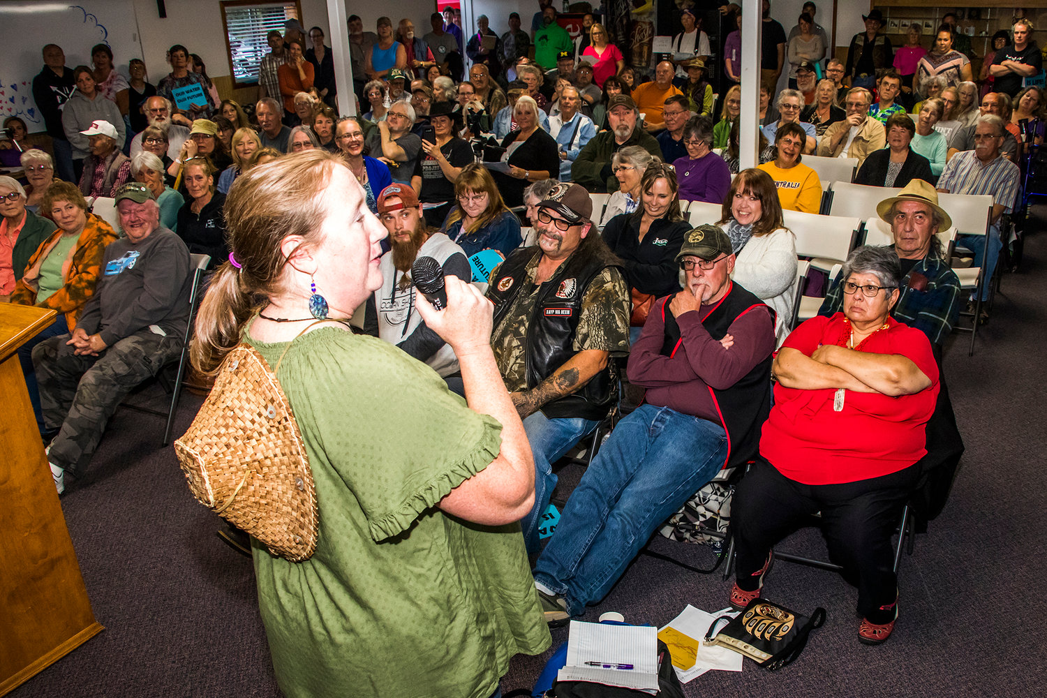 Teri Graves, a member of the Cowlitz Tribe, addresses a packed town hall in Randle about a proposed water bottling plant that has drawn strong opposition in the community.