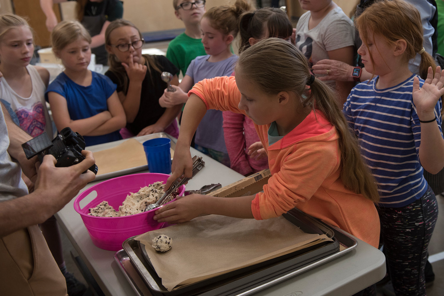 Kids line up at the Boys &amp; Girls Club of Chehalis to scoop cookie dough onto a baking sheet on Tuesday, June 25, 2019.