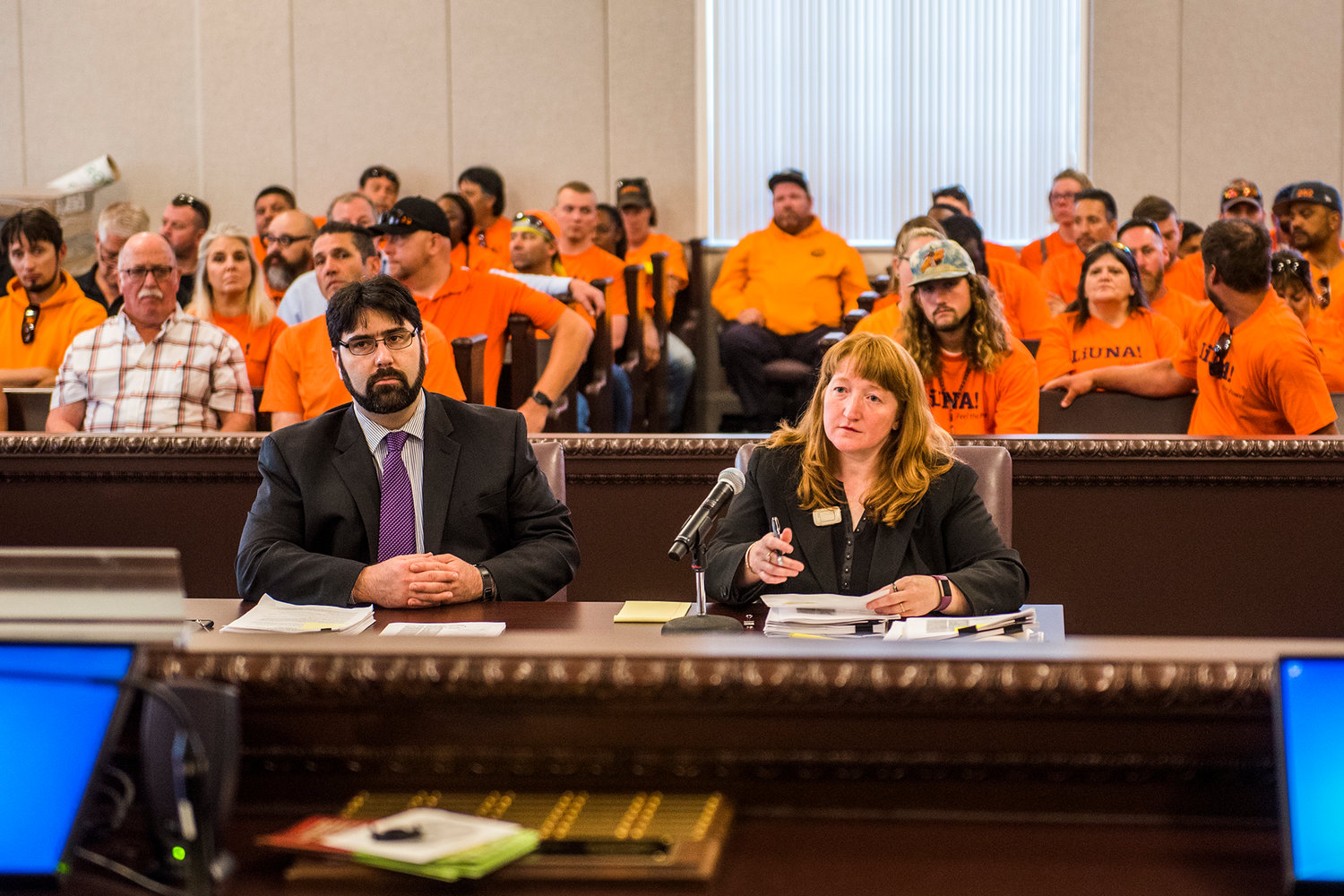 Scores of members of the Laborers' International Union of North America sit in on a hearing on the Skookumchuck Wind Energy Project to push for local hiring. Civil deputy prosecutor Eric Eisenberg, left, and senior project planner Karen Witherspoon represented the county at the hearing.