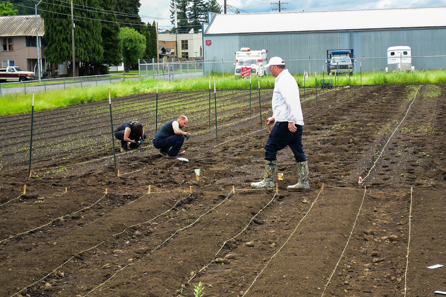 Volunteers work in the community garden at the Salvation Army in Centralia.