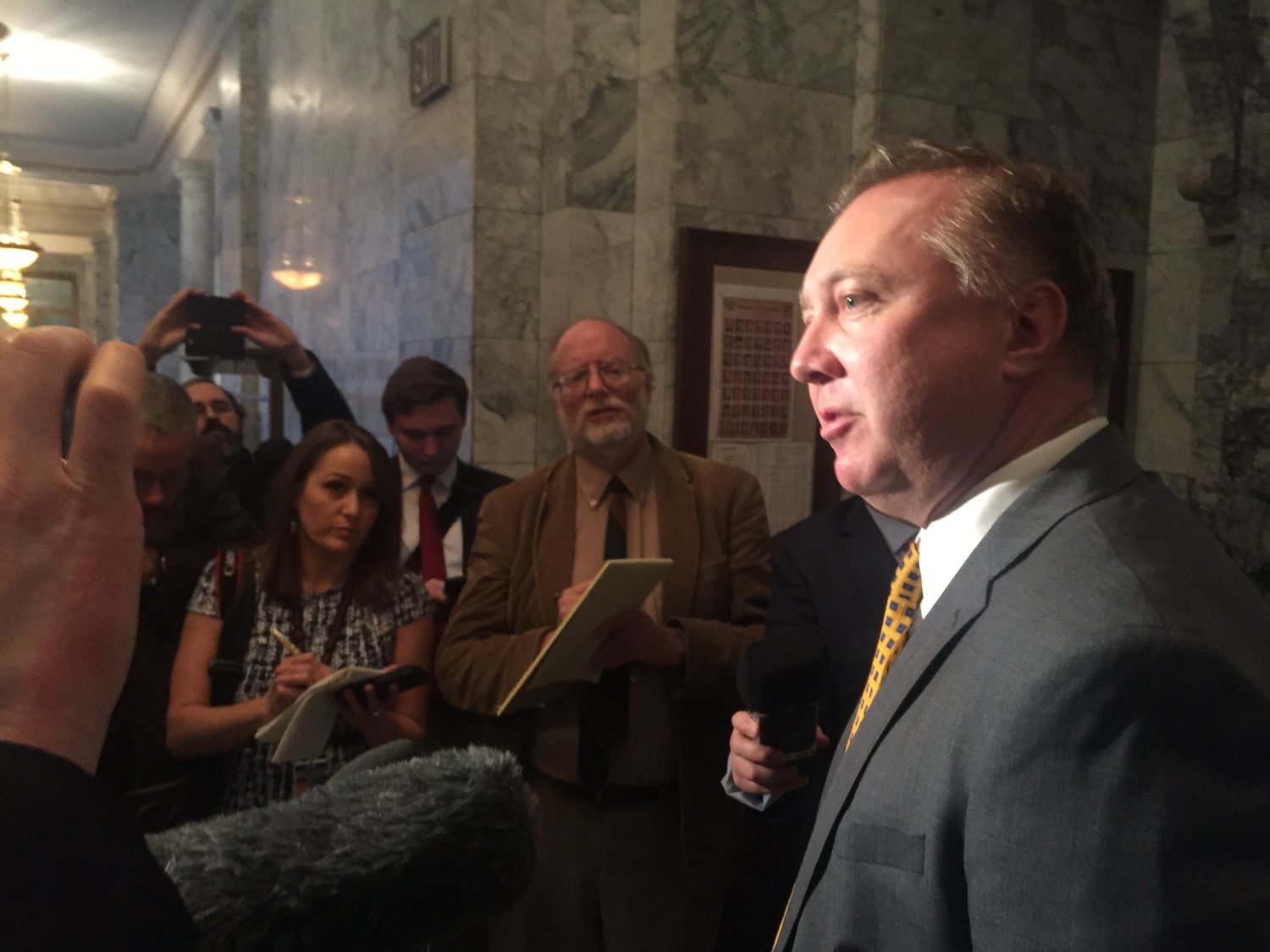 Sen. Doug Ericksen, R-Ferndale, gives a quick hallway press conference in January 2018. 