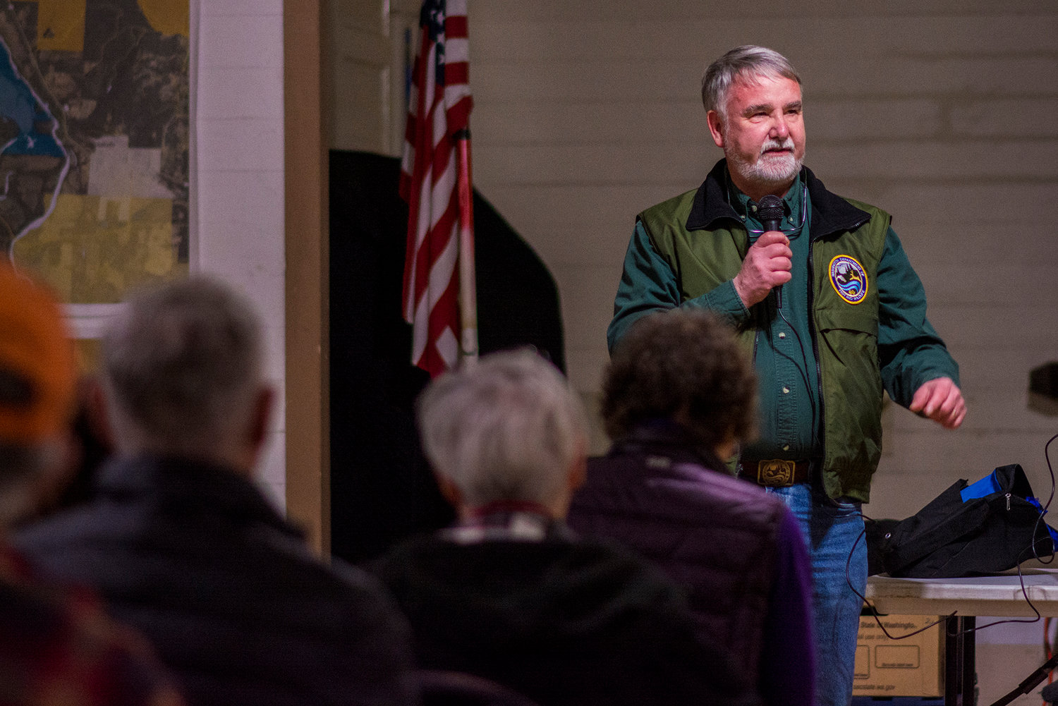 Brian Calkins of the Washingotn Department of Fish and Wildlife addresses the public Monday night during a workshop on the Scatter Creek Wildlife Area in Rochester.