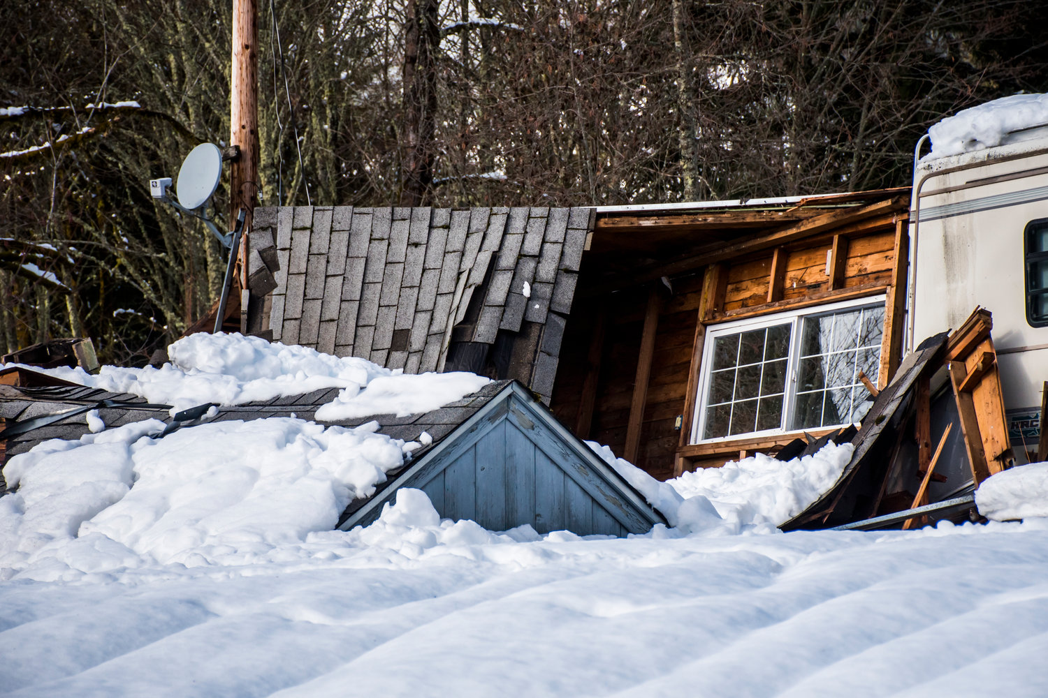 A collapsed residence was unoccupied when a snowstorm brought the house down, seen Wednesday afternoon in Mineral.