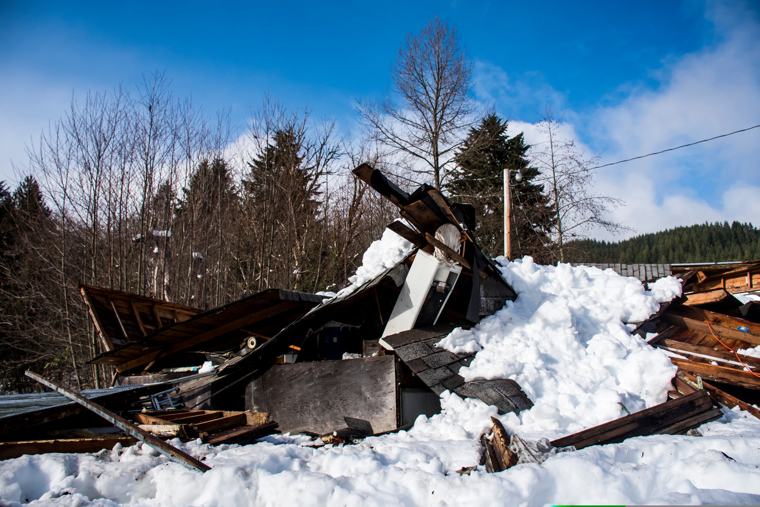 A collapsed residence was unoccupied when a snowstorm brought the house down, seen Wednesday afternoon in Mineral.