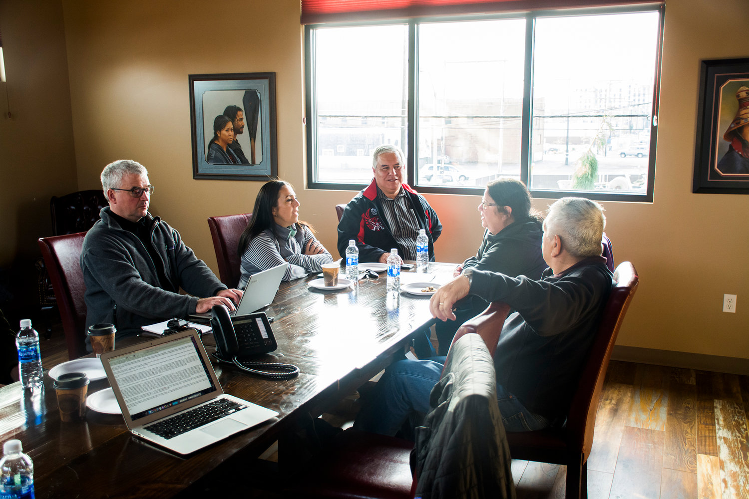 Quinault Indian Nation leaders talk in a meeting room at Q-Mart in Aberdeen Tuesday.