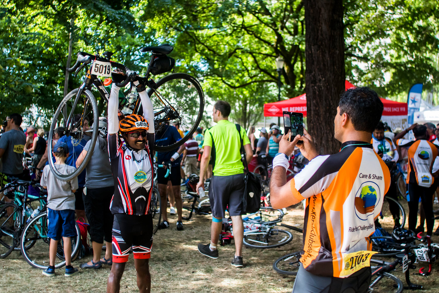 STP finishers pose for photos Sunday afternoon at Holladay Park in Portland, Oregon.