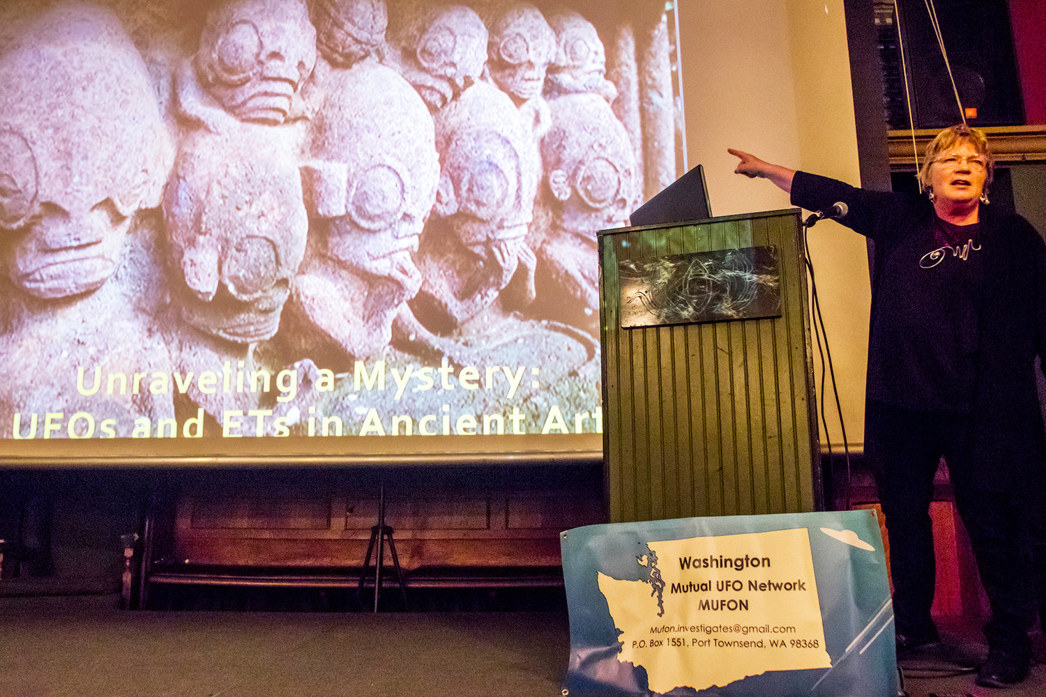 Maurene Morgan, the Washington State Mutual UFO Network (MUFON) State Section Director, talks about ancient artifacts found around the world that are believe to be linked with alien contact, during the "Unraveling A Mystery: UFOs and ETs in Ancient Art" showcase during Tuesday night History Pub at McMenamins Olympic Club.