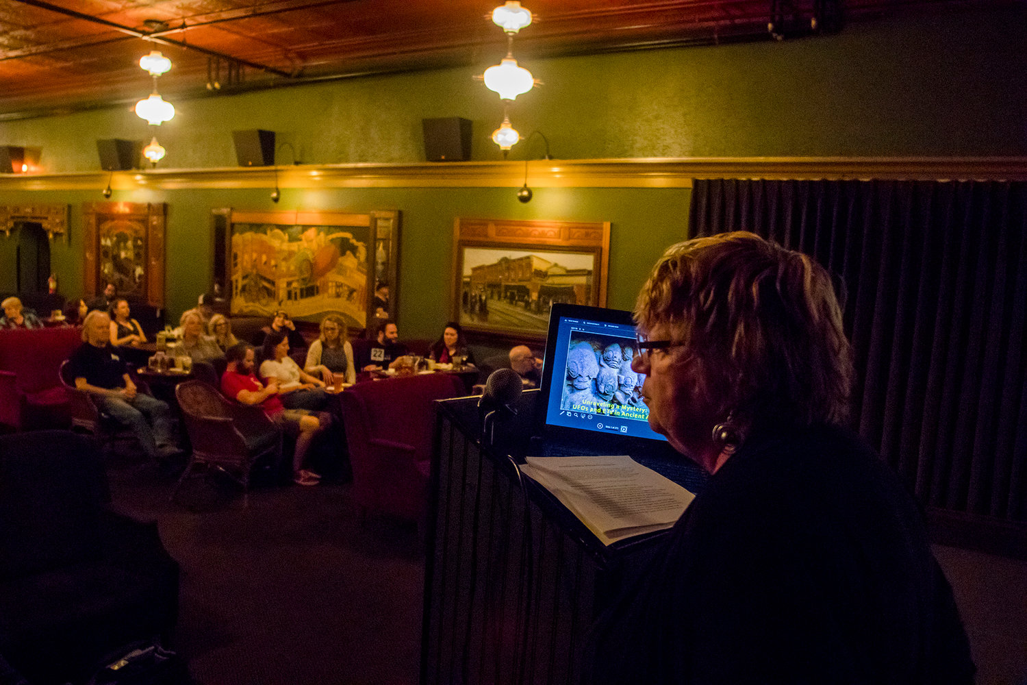 Maurene Morgan, the Washington State Mutual UFO Network (MUFON) State Section Director, prepares to talk to crowds, during the "Unraveling A Mystery: UFOs and ETs in Ancient Art" showcase during Tuesday night History Pub at McMenamins Olympic Club.