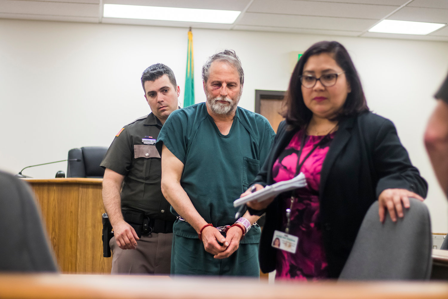 Edward L. Danzer, center, 63, of Tenino makes an appearance Friday afternoon in Lewis County Superior Court following an alleged assault of an attorney on Thursday.