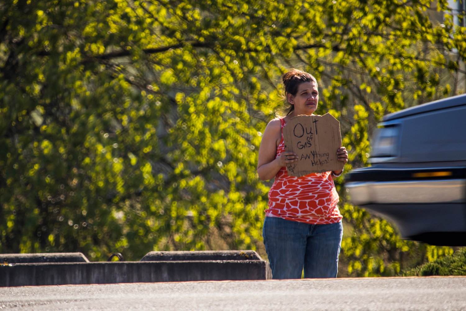 A panhandler is seen in Tuesday afternoon in Chehalis.
