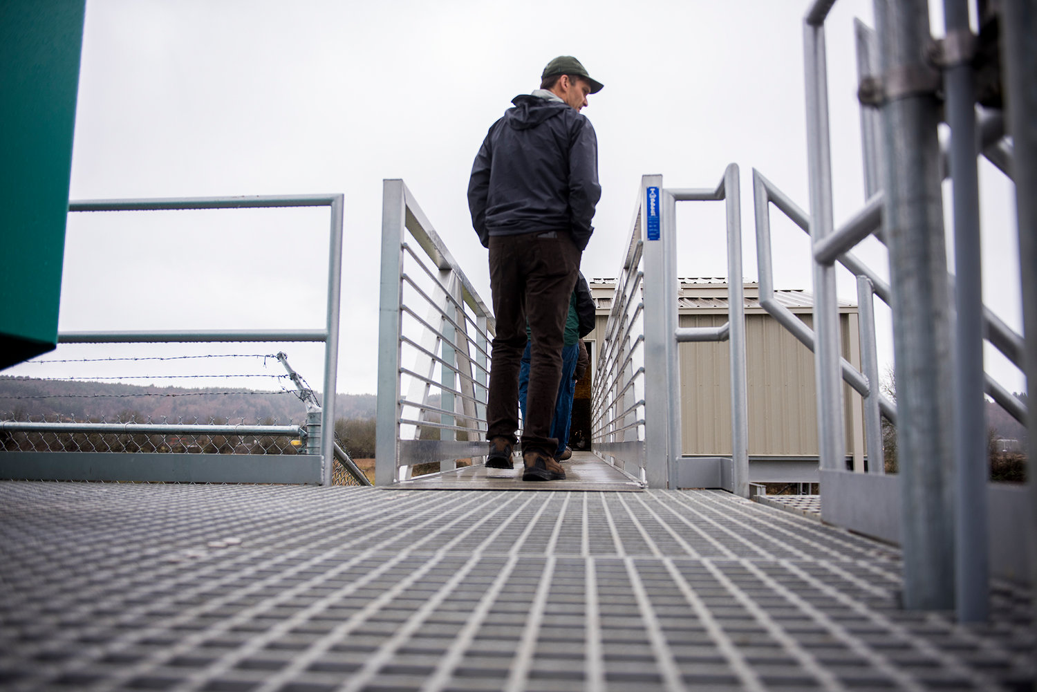 Scott Boettcher of the Chehalis Basin Flood Authority looks south from the catwalk leading to the elevated pump house at the Centralia/Chehalis Airport during a tour on Thursday afternoon.