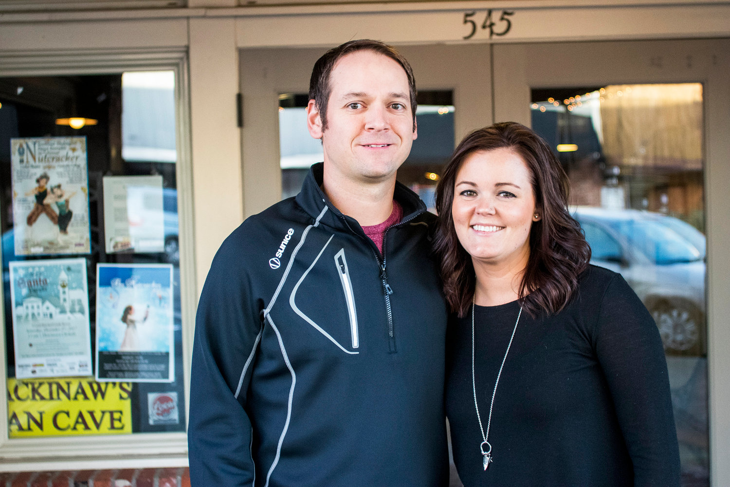 Jason Boettner, left, and his wife Shawna Boettner, right, pose for a photo Wednesday afternoon in downtown Chehalis.