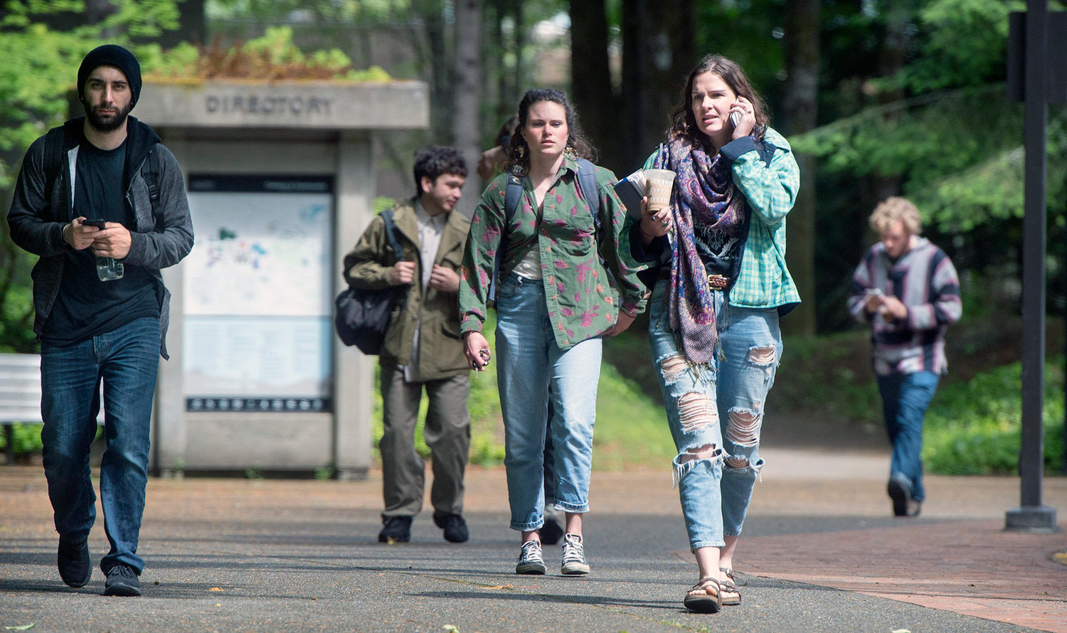 Students leave The Evergreen State College campus in Olympia after a threat prompted a student alert and evacuation on Thursday, June 1, 2017. The announcement posted on the school's website Thursday asked everyone to leave the Olympia campus or return to residence halls for further instructions. (Tony Overman /The Olympian via AP)
