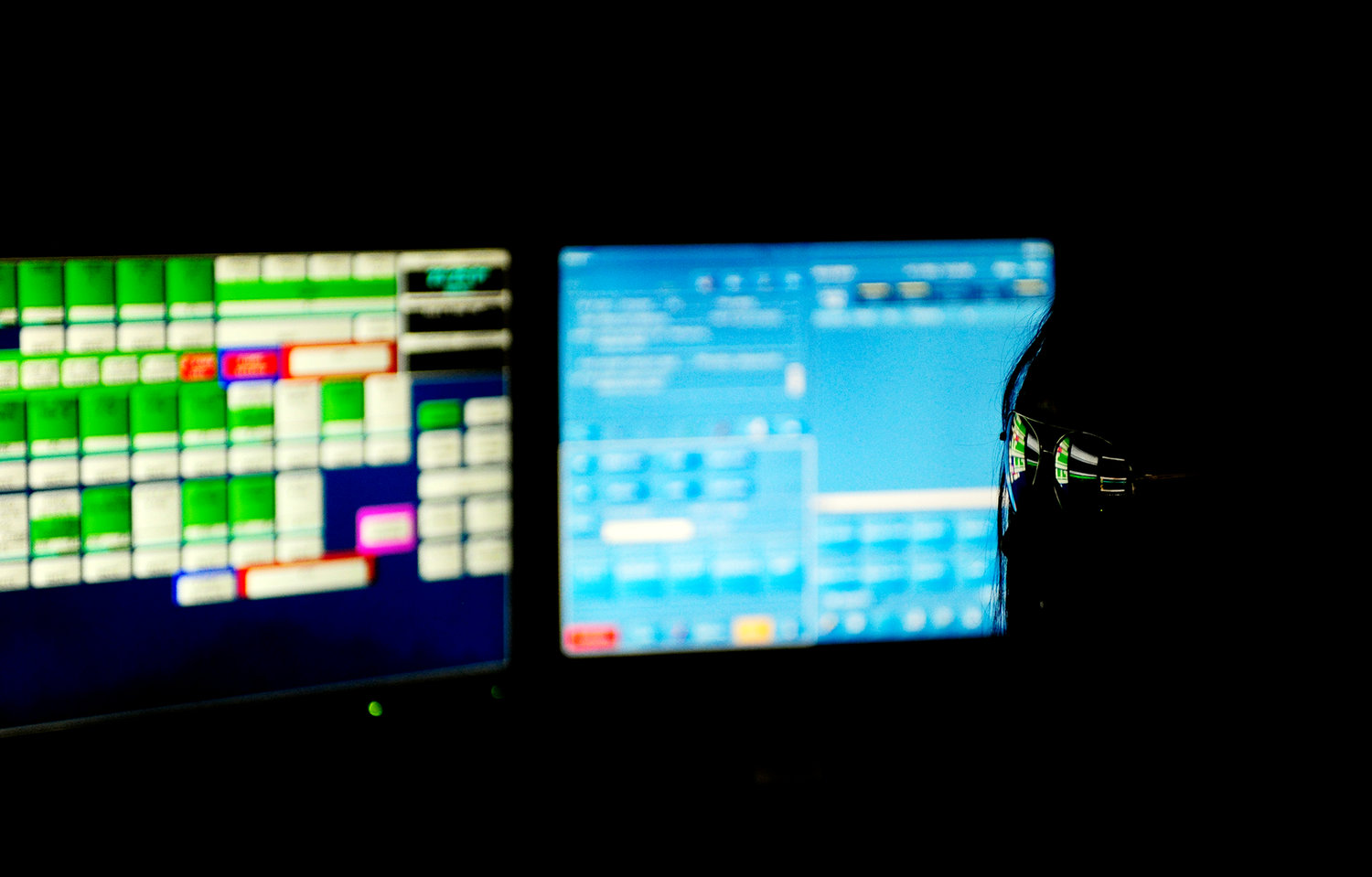 In this Sept. 11, 2012, file photo, sunglasses reflect the computer screens in front of a Lewis County 911 Communications Center dispatcher as she takes a call during a Friday night shift. The center is located on the top floor of the Lewis County Courthouse. 