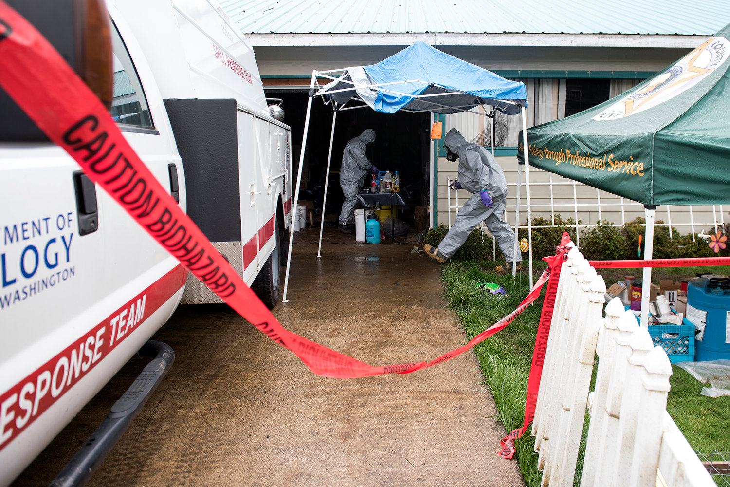 Workers from the Washington Department of Ecology's Emergency Response Team test chemicals found in an alleged methamphetamine lab on Joppish Road in Galvin on Tuesday afternoon.
