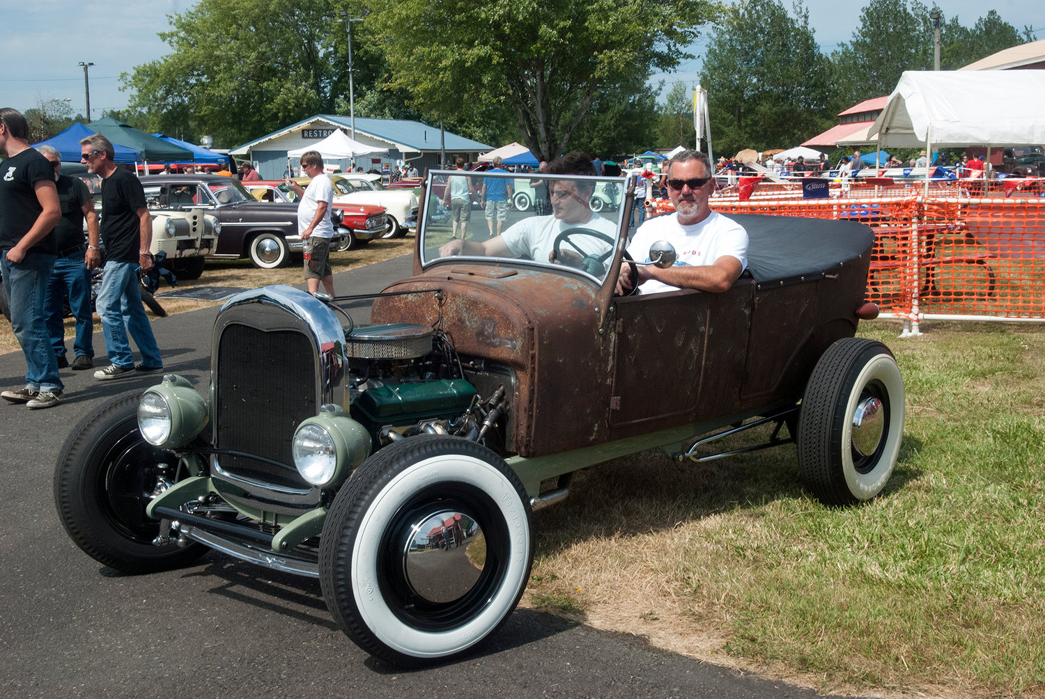 Aaron, left and Dennis Jaeger, cruise around the Billetproof NorthWest car show at the Southwest Washington Fairgrounds Saturday in a 1927 Ford Model T Touring hot rod.