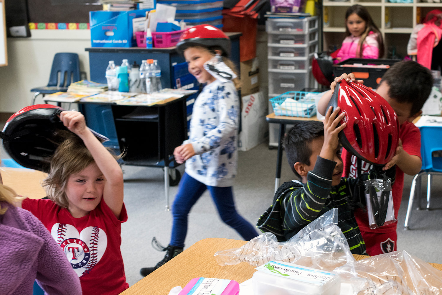 Edison Elementary student's in Alia Sherwood's kindergarten class tryout their new helmets that were provided to them on Friday by the PTO.