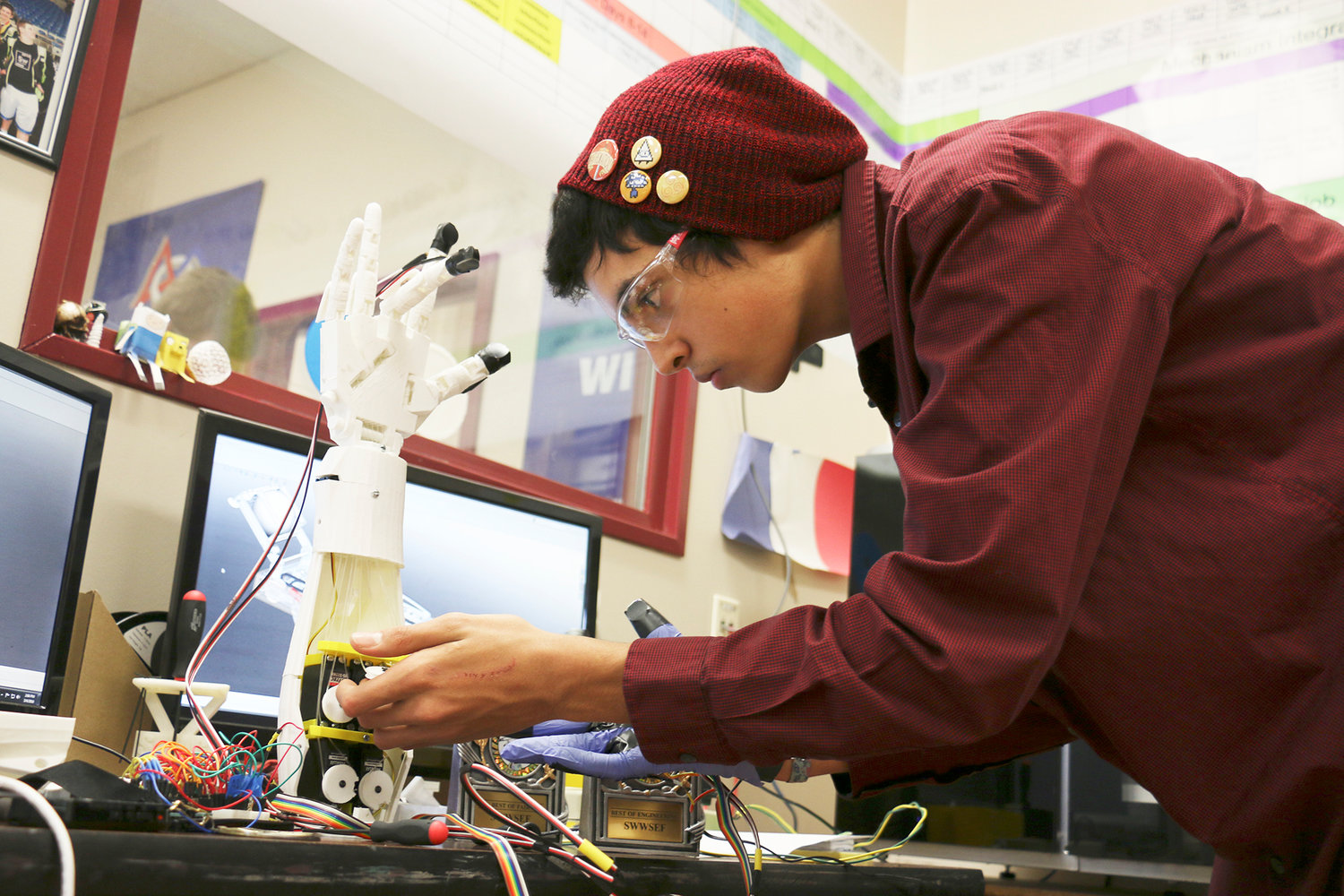 W.F. West Senior Niko Bhagwandin makes adjustment to a remote arm he built. The robot mimics Bhagwandin's movements when he wears a special glove he designed and built. Bhagwandin will compete in the Intel International Science and Engineering Fair in Phoeniz, Ariz. in May.