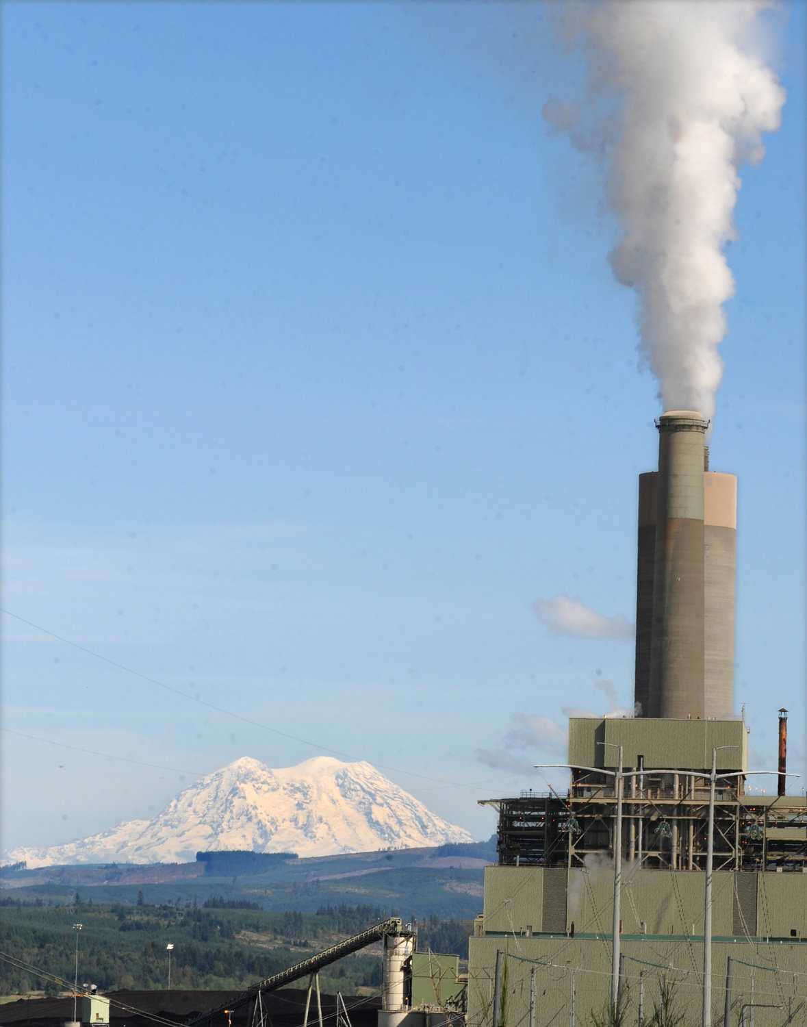 In this Sept. 9, 2010 file photo, Mt. Rainier sits behind TransAlta's steam power plant north of Centralia.