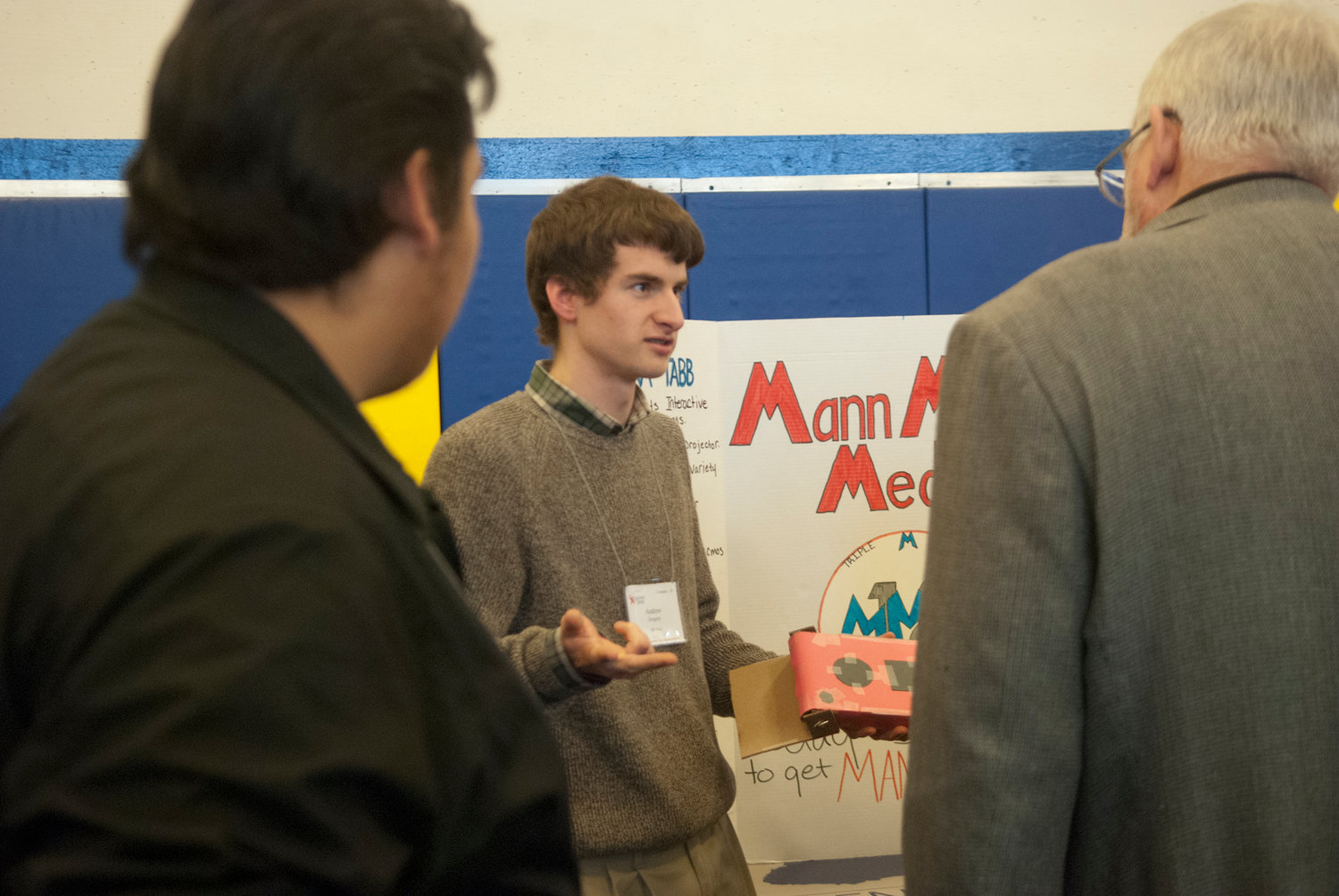 Student Andrew Gregory tells judges, acting as potential investors, about his team’s product at the trade show portion of Washington Business Week at Centralia College on Thursday. Juniors from W.F. West and Centralia high schools spent the week learning about business by running their own fictitious enterprise.