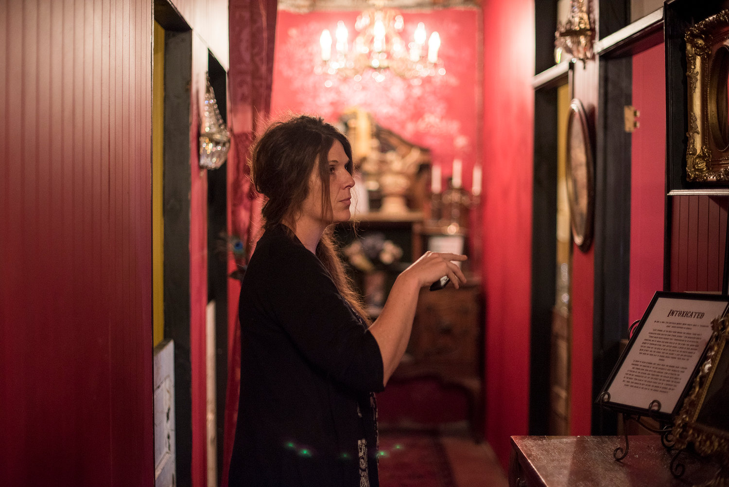 Ornate chandeliers hang from the ceilings as Holly Phelps, owner of the Shady Lady in downtown Centralia, stands in one of the hallways of her new Bordello Museum.