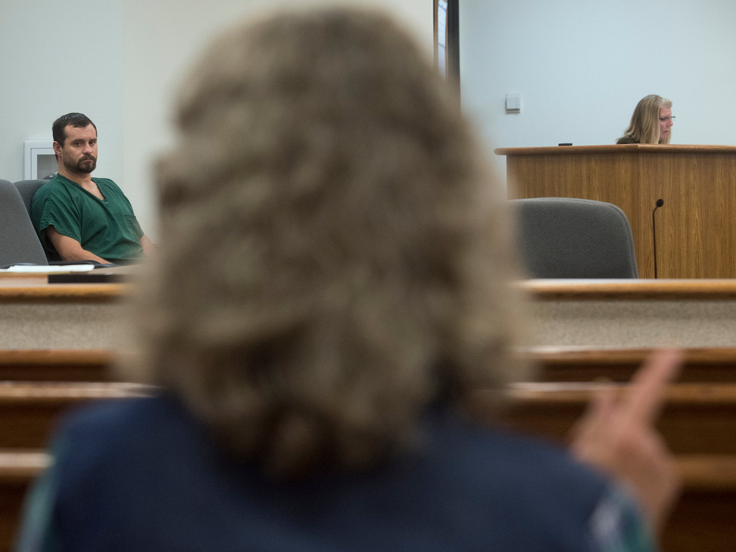 Gail Goodwin uses sign language to communicate with her son, James W. McMillion, who is deaf, prior to the start of his change-of-plea hearing in Lewis County Superior Court on Wednesday afternoon at the Lewis County Law and Justice Center in Chehalis.