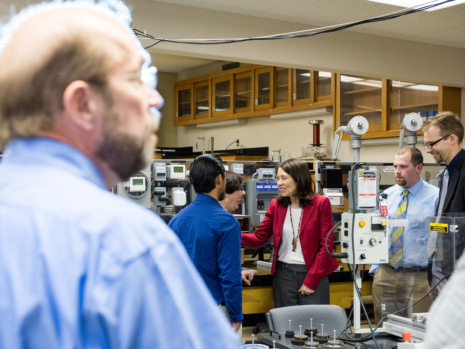 Barbara Hins-Turner, director of the Pacific Northwest Center of Excellence for Clean Energy, center, laughs with U.S. Sen. Maria Cantwell, D-Washington, as she tours an electrical engineering classroom in Kemp Hall at Centralia College on Wednesday afternoon.